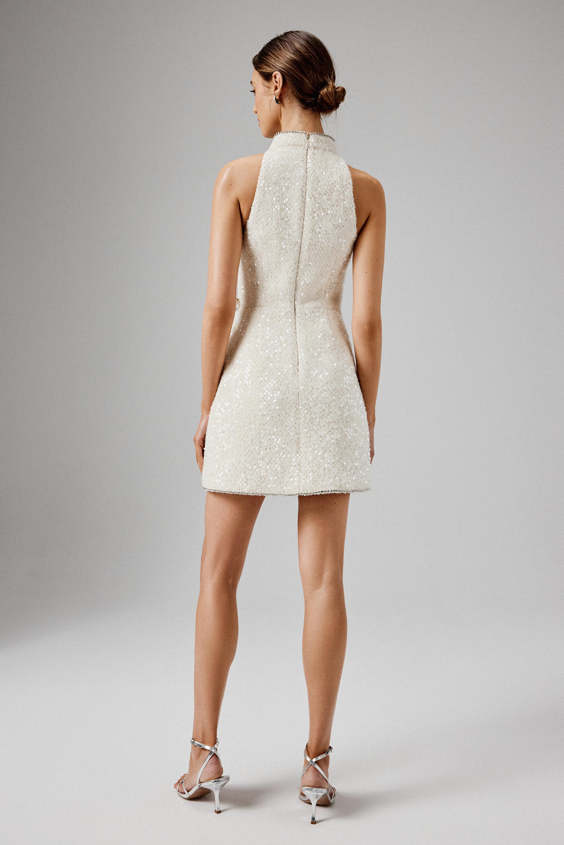 SOLENE Sequin Boucle High Collar Mini Dress with Bow Embellishment in Beige